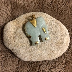 Jade and gold elephant pendant.